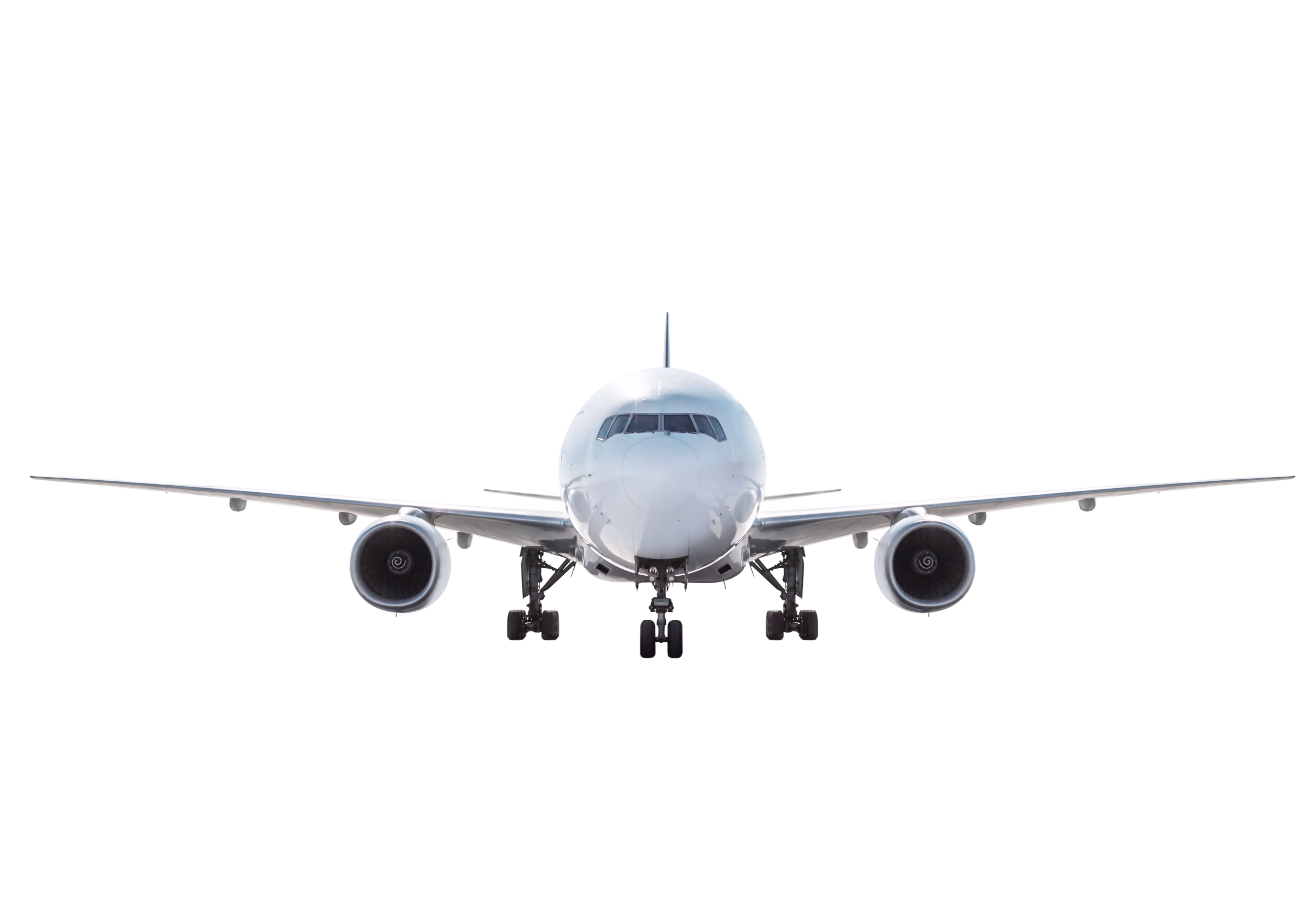 Commercial aircraft flying above clouds