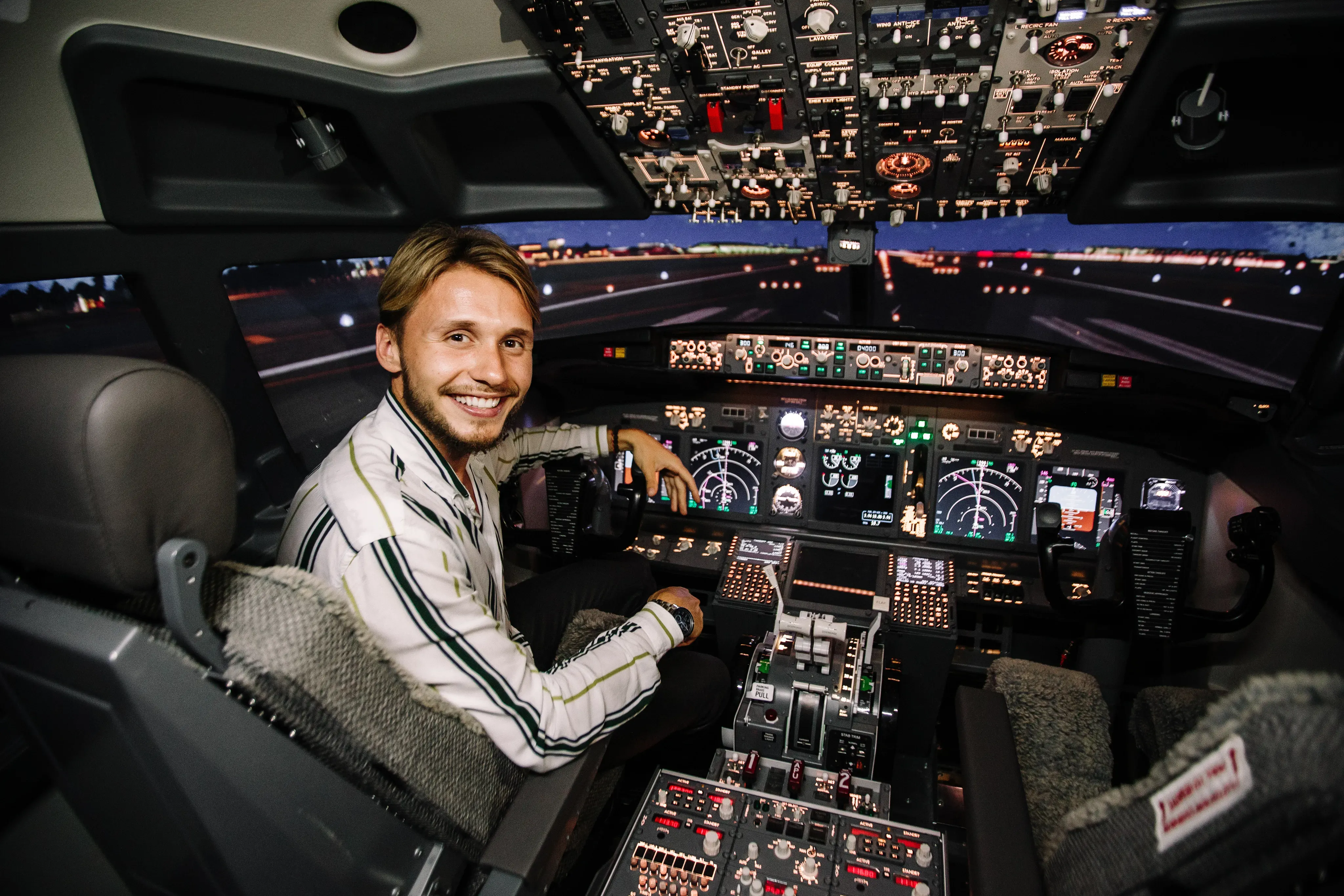 Pilot in cockpit reviewing operational data